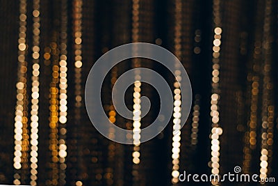 Golden shiny fabric with sequins, blured abstract background Stock Photo