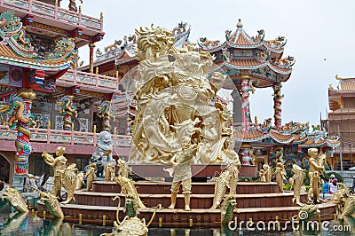 Golden shrine Nezha statue Chinese angel in Buddhist temple Editorial Stock Photo