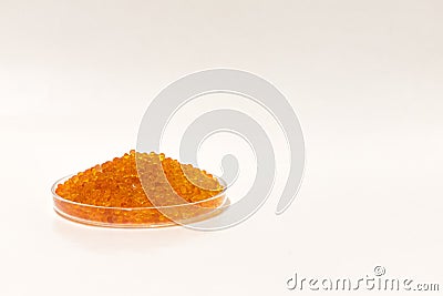 Silica gel dessicant in a glass bowl on a white background Stock Photo