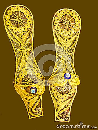 Golden slippers vintage hand made souvenir Stock Photo