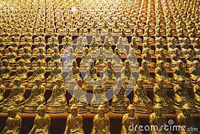 Golden Small Buddha Statues inside Yakcheonsa Temple. Jeju, South Korea Stock Photo