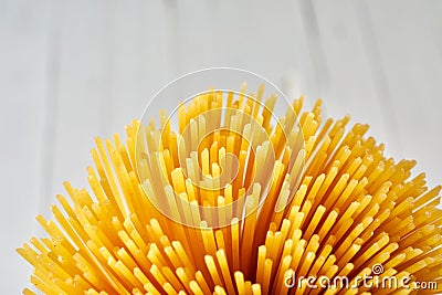 Golden spaghetti bundle close up with copy space Stock Photo
