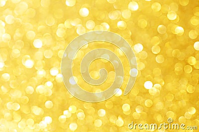 Golden sparkle glitters with bokeh effect and selectieve focus. Festive background with bright gold lights, champagne bubble. Stock Photo