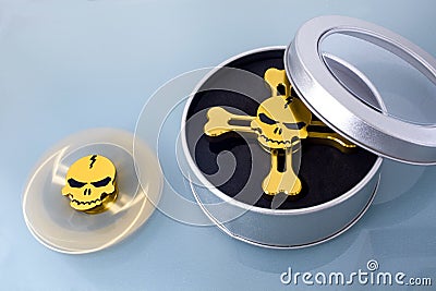 Golden spinner in the form of a skull Stock Photo