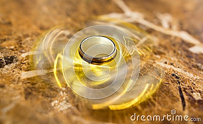 The golden spinner is spinning on the table Stock Photo