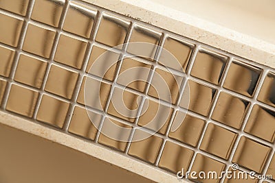 Golden square tile Stock Photo