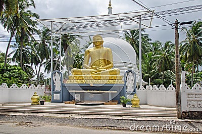 A golden statue of Buddha Editorial Stock Photo