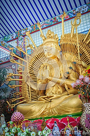 Golden statue of Guan Yin with 1000 hands. Guanyin or Guan Yin i Stock Photo