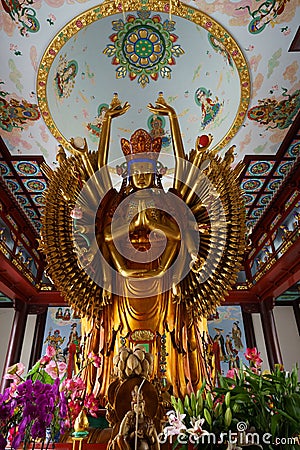 Golden Statue of Guanyin Bodhisattva with Thousand Hands and Thousand Eyes Editorial Stock Photo
