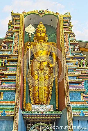 The golden statue in Hindu Temple Editorial Stock Photo