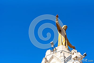 Golden Statue of Jesus Christ on the facade of the Temple of the Sacred Heart of Jesus, Barcelona, Catalonia, Spain Stock Photo