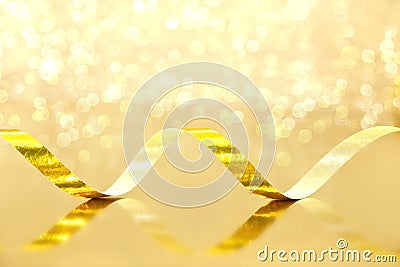 Golden Streamer on shiny background. Holiday background or greet Stock Photo