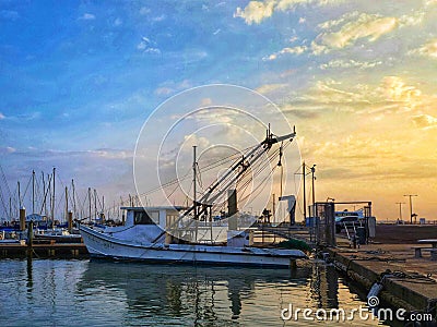 Golden sunrise over the harbor with sailing boats Editorial Stock Photo