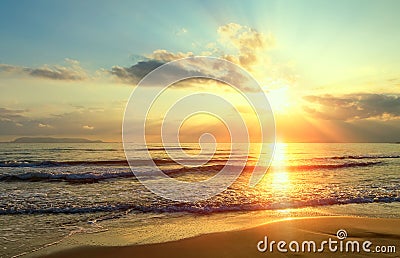 Golden sunrise sunset over the sea ocean waves. Rich in dark clouds, rays of light Stock Photo