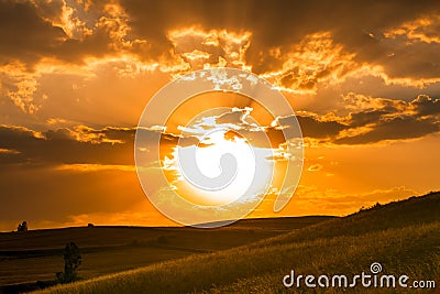 Golden sunset over hills Stock Photo