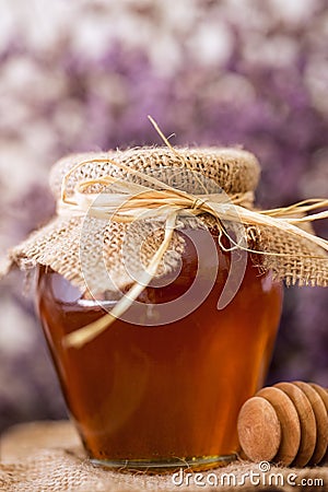 Golden sweet honey jar on the table Stock Photo