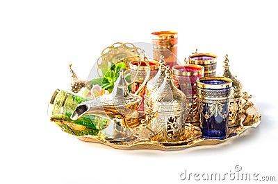 Golden tea service green mint leaves Ramadan Mubarak Stock Photo