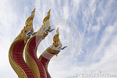 Golden three headed naga statue Stock Photo