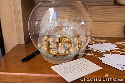 Golden walnut in a glass round vase. Stock Photo