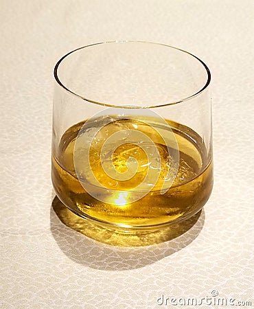 golden whiskey glass. Whisky on the rocks Stock Photo