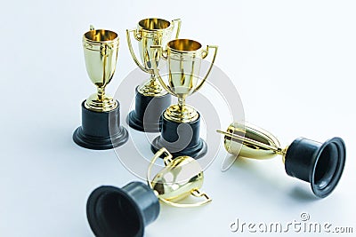 Golden winner cups on a white background. Competitions concept Stock Photo