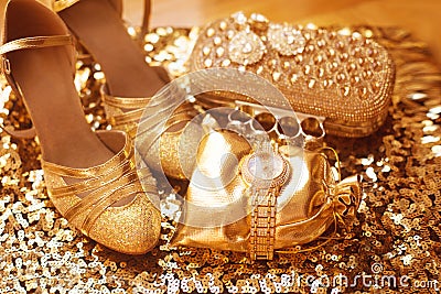 Golden. Women clothes and accessories. Luxury jewelry. Fashion d Stock Photo