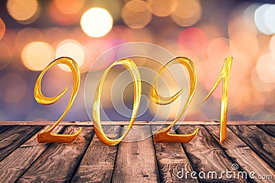 Golden 2021 on wood table top with blurred lights background new year holiday greeting card Stock Photo