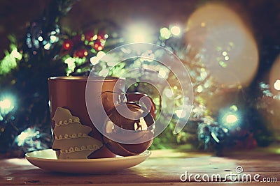 Golden Xmas bells, coffee cup and cookie Stock Photo