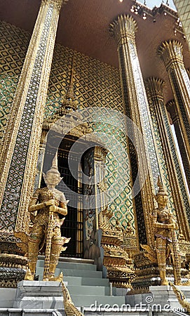 Golden Yaksa giant in full decoration guarding royal temple Stock Photo