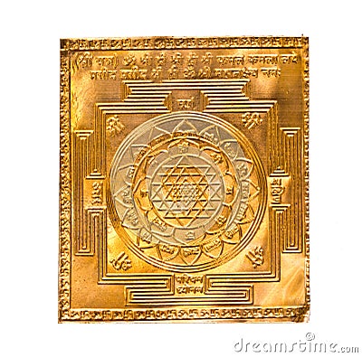 Golden yantra on white.Manufactured Stock Photo