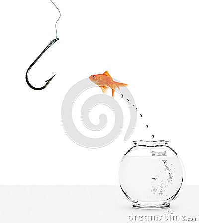 Goldfish jumping out of bowl towards empty hook Stock Photo