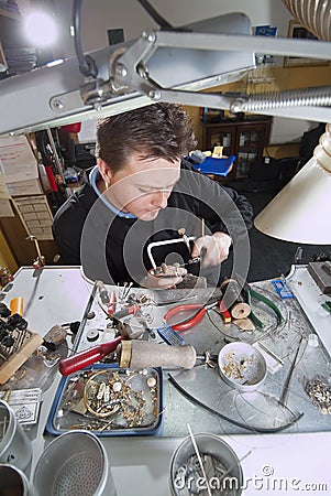 Goldsmith in his laboratory Stock Photo