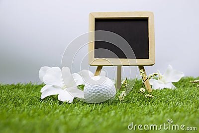 Golf class with golf ball and chalkboard on white background Stock Photo