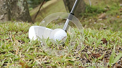 Golf ball and golf club ready for swing Stock Photo