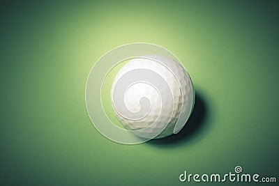 Golf ball on green background Stock Photo