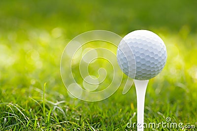 Golf ball on green grass bokeh background Stock Photo