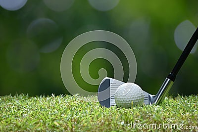 Golf ball on green grass ready to be struck on golf course Stock Photo