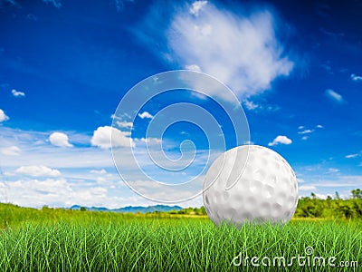 Golf ball on green grass side view Stock Photo