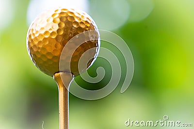 Golden golf ball is the world`s biggest sport Stock Photo