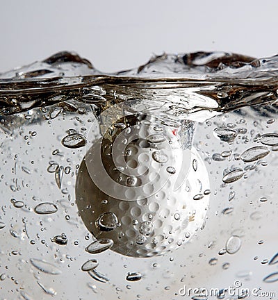 Golf ball splash Stock Photo