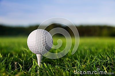 Golf ball on tee Stock Photo