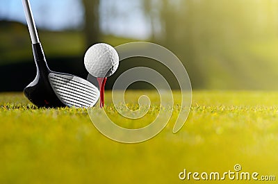 Golf ball on tee with driver Stock Photo