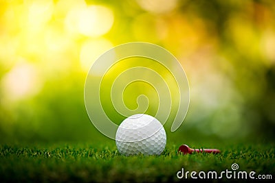 Golf ball with tee Stock Photo