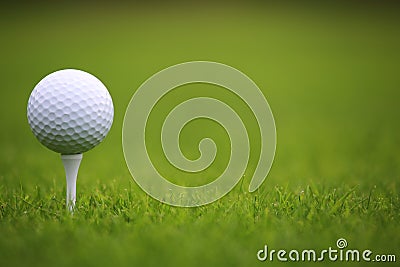 Golf ball on tee Stock Photo