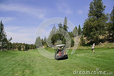 Golf cart and lady golfer Stock Photo