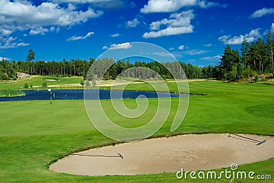 Golf fairway along a pond Stock Photo