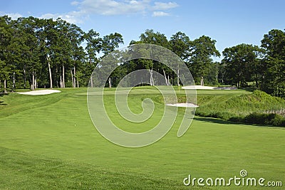 Golf fairway and green with bunkers Stock Photo