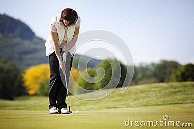 Golf player putting ball. Stock Photo