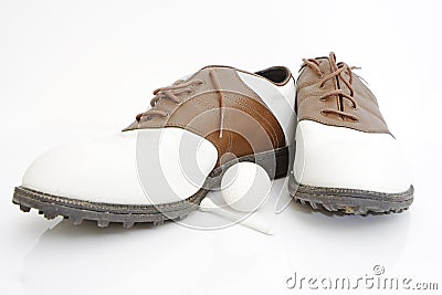 Golf shoes ball and tee Stock Photo
