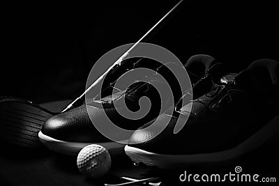 Golf shoes on isolated black background. Stock Photo